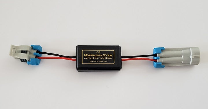 Warning Star third brake light pulse module installed on a Chevrolet Corvette C6, showing the plug-and-play wiring harness and sequential safety blinker