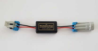 Warning Star third brake light pulse module installed on a Chevrolet Corvette C6, showing the plug-and-play wiring harness and sequential safety blinker